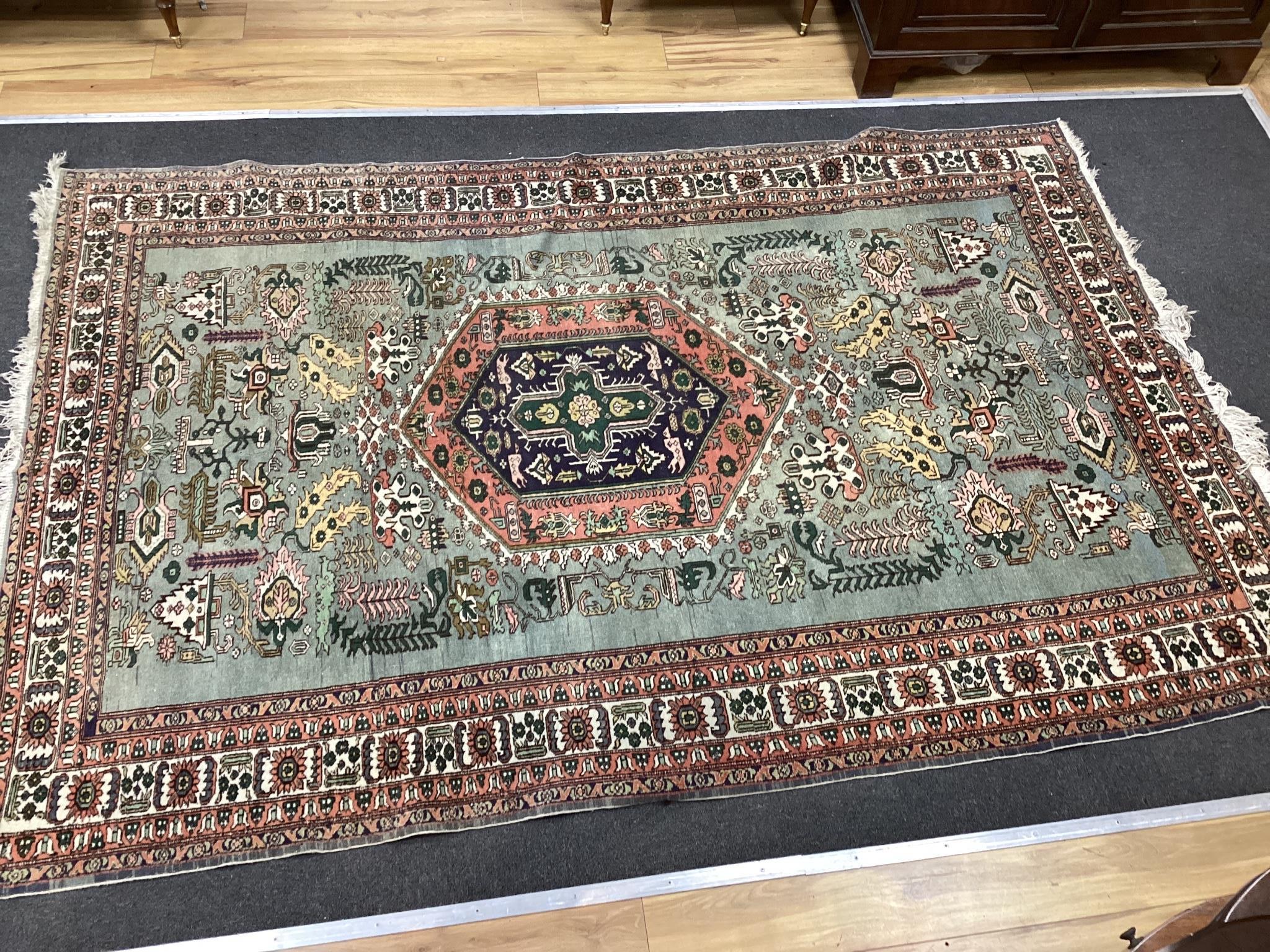 A Turkish faded blue ground carpet, 264cm x 170cm